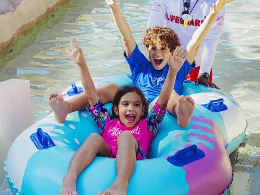 Kids on raft ride at Wild Wadi Waterpark in Dubai