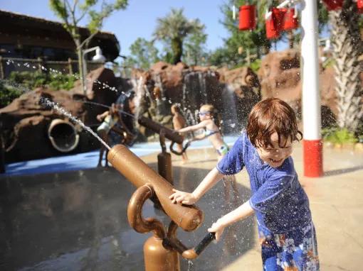Children at Uwanja Camp water playground, Disney’s Animal Kingdom Lodge