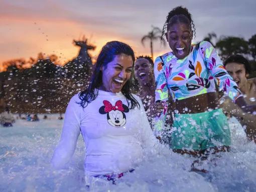 Girls in wave pool - Disney H2O Glow Nights at Disney’s Typhoon Lagoon