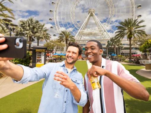 Guests taking a selfie in front of the Orlando Eye