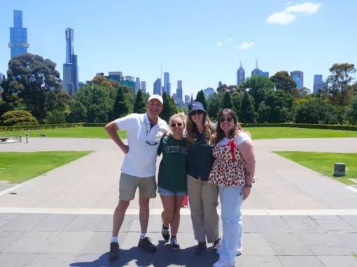 Tour guide with a group of smiling guests during the Melbourne City Discovery Tour