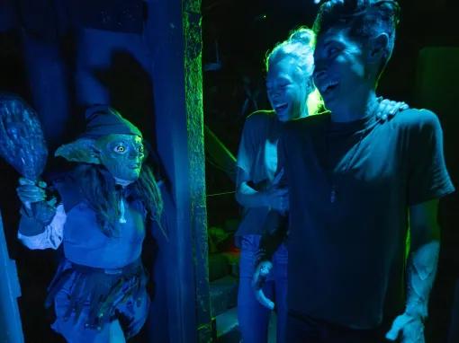Guests in scare house at Universal Orlando Halloween Horror Nights