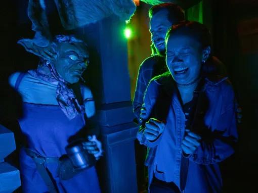 Guests in scare house at Universal Orlando Halloween Horror Nights