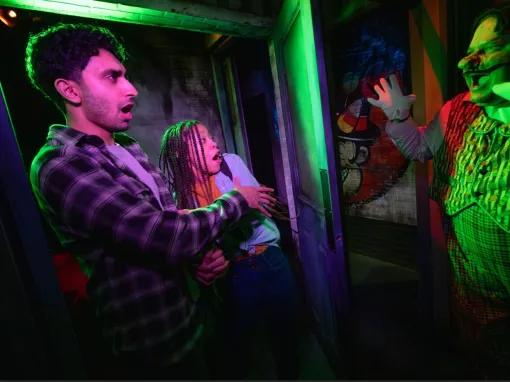 Guests in scare house at Universal Orlando Halloween Horror Nights