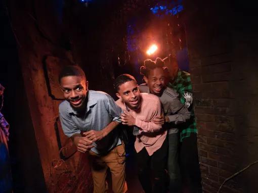 Guests in scare house at Universal Orlando Halloween Horror Nights