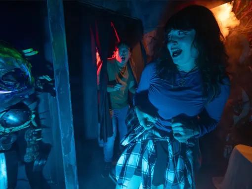 Guests in scare house at Universal Orlando Halloween Horror Nights