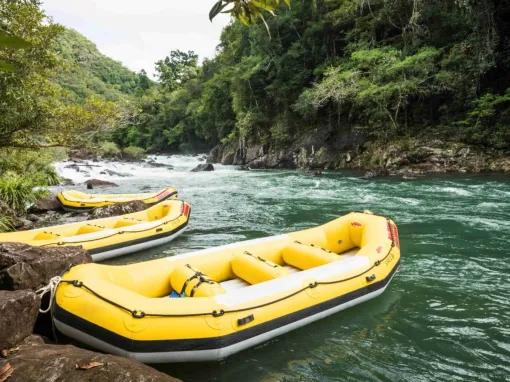 Empty rafts lined up on the Barron River ready for white water rafting adventure