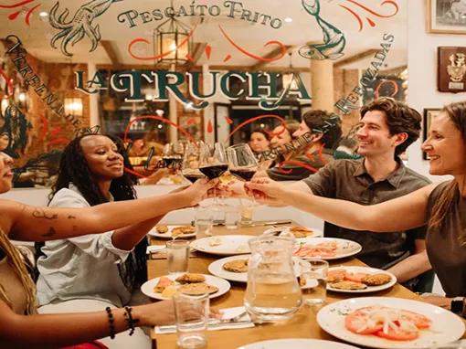 A group enjoying a Tapas meal