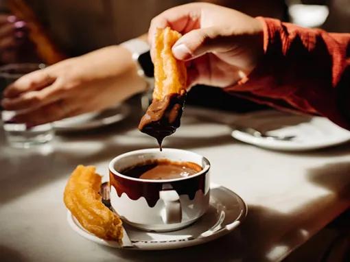 Churro dipped in chocolate