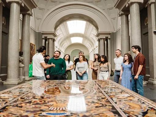 Tour guide explaining the art