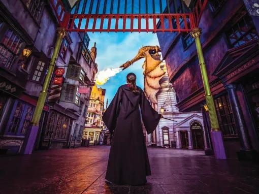 Girl in Harry Potter cloak in front of Gringott's Bank, Universal Studios Florida