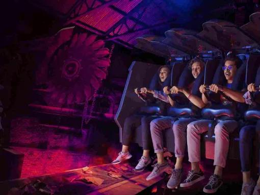 xcited riders enjoying the Batman: Knight Flight roller coaster at Warner Bros. World Abu Dhabi