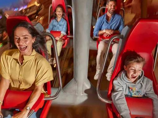Warner Bros. World Abu Dhabi Guests enjoying the Fast and Furry-ous Roller Coaster at Warner Bros. World Abu Dhabi, smiling and having fun