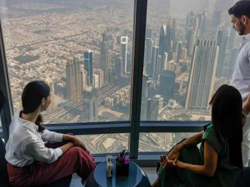 Visitors enjoying panoramic views of Dubai from Burj Khalifa Sky 148th Floor Observation Deck