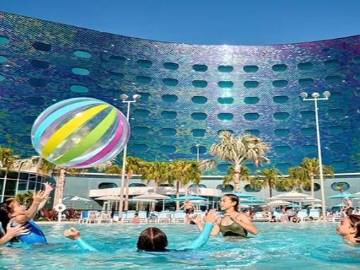 Family playing in the pool