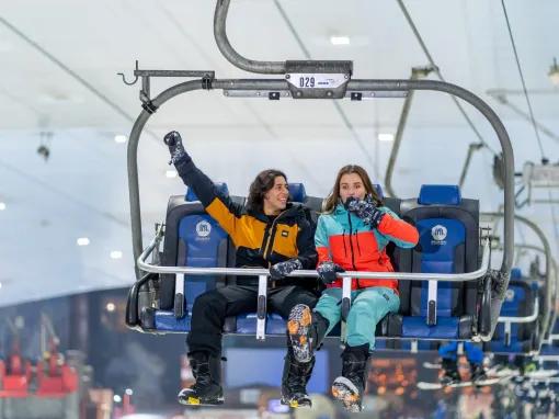 Guests enjoying the chairlift at Ski Dubai