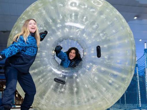 Guests enjoying the Zorb Ball at Ski Dubai