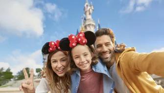 Family in front of Sleeping Beauty Castle at Disneyland Paris