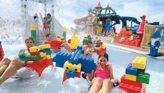 Family on Build-A-Raft River at LEGOLAND Dubai Water Park