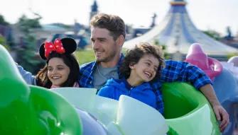 Family enjoying Dumbo the Flying Elephant ride at Disneyland Paris
