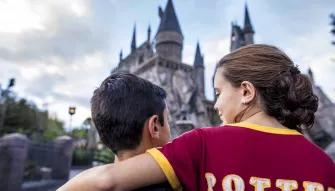 Siblings in front of Hogwarts Castle at Universal's Islands of Adventure
