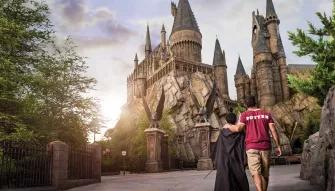 Father and son in front of Hogwarts Castle at Universal's Islands of Adventure