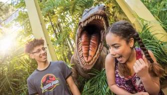 Teens with dinosaur at Universal's Islands of Adventure