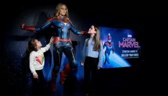 Girls with Captain Marvel at Madame Tussauds London