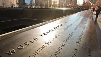 Names of victims of the 2001 and 1993 attacks inscribed into bronze panels surrounding the reflecting pools outside the 9/11 Memorial Museum