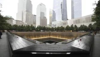 Names of victims of the 2001 and 1993 attacks inscribed into bronze panels surrounding the reflecting pools outside the 9/11 Memorial Museum