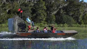 Guests enjoying an airboat ride at Boggy Creek Orlando