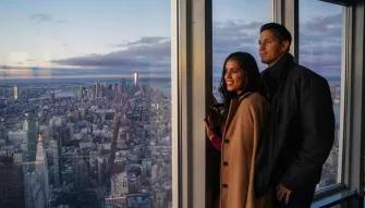 Couple enjoying the views from the 80th Floor Observatory at the Empire State Building