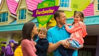 Family outside the Furchester Hotel at Cbeebies land, Alton Towers