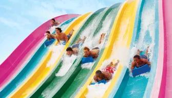 Teens racing down Taumata Racer at Aquatica Orlando
