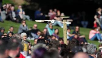 Owl flying over crowd during Falconer’s Quest Bird of Prey Show at Warwick Castle