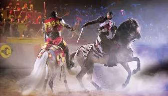 Medieval Times Orlando Dinner Show & Tournament Knights with swords on horseback at Knights riding horses in the arena at Medieval Times Orlando Dinner Show & Tournament