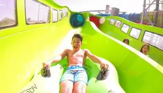 Guest riding a water slide at Aquatica