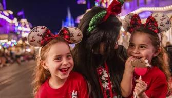 Guests enjoying yuletide treats at Mickey’s Very Merry Christmas Party in Magic Kingdom Park