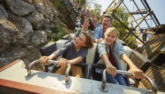 Guests riding El Diablo - Tren de la mina at PortAventura theme park