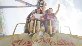 Guests riding Shambhala at PortAventura theme park