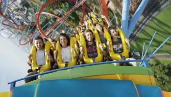 Guests riding Dragon Khan at PortAventura theme park