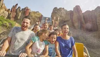 Guests riding Tutuki Splash at PortAventura theme park