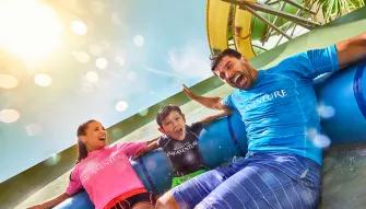 Family enjoying Aquaconda water slide at Aquaventure Dubai