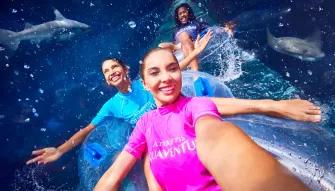Friends riding Shark Attack waterslide at Aquaventure Dubai