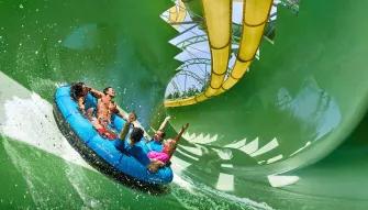 Friends riding Aquaconda water slide at Aquaventure Dubai