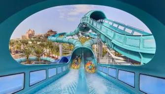 Guests riding Medusa's Lair water slide at Aquaventure Dubai