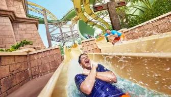 Man riding Slitherine water slide at Aquaventure Dubai