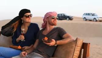 Guests enjoying drinks and canapes on the Platinum Heritage Safari in the Dubai Desert