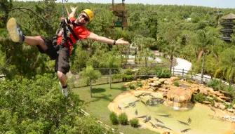Man riding the Screamin’ Gator Zip Line at Gatorland