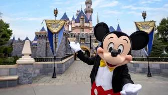 Mickey Mouse in front of Sleeping Beauty Castle, Disneyland Park in California